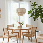 Dining table with tassel lampshade above